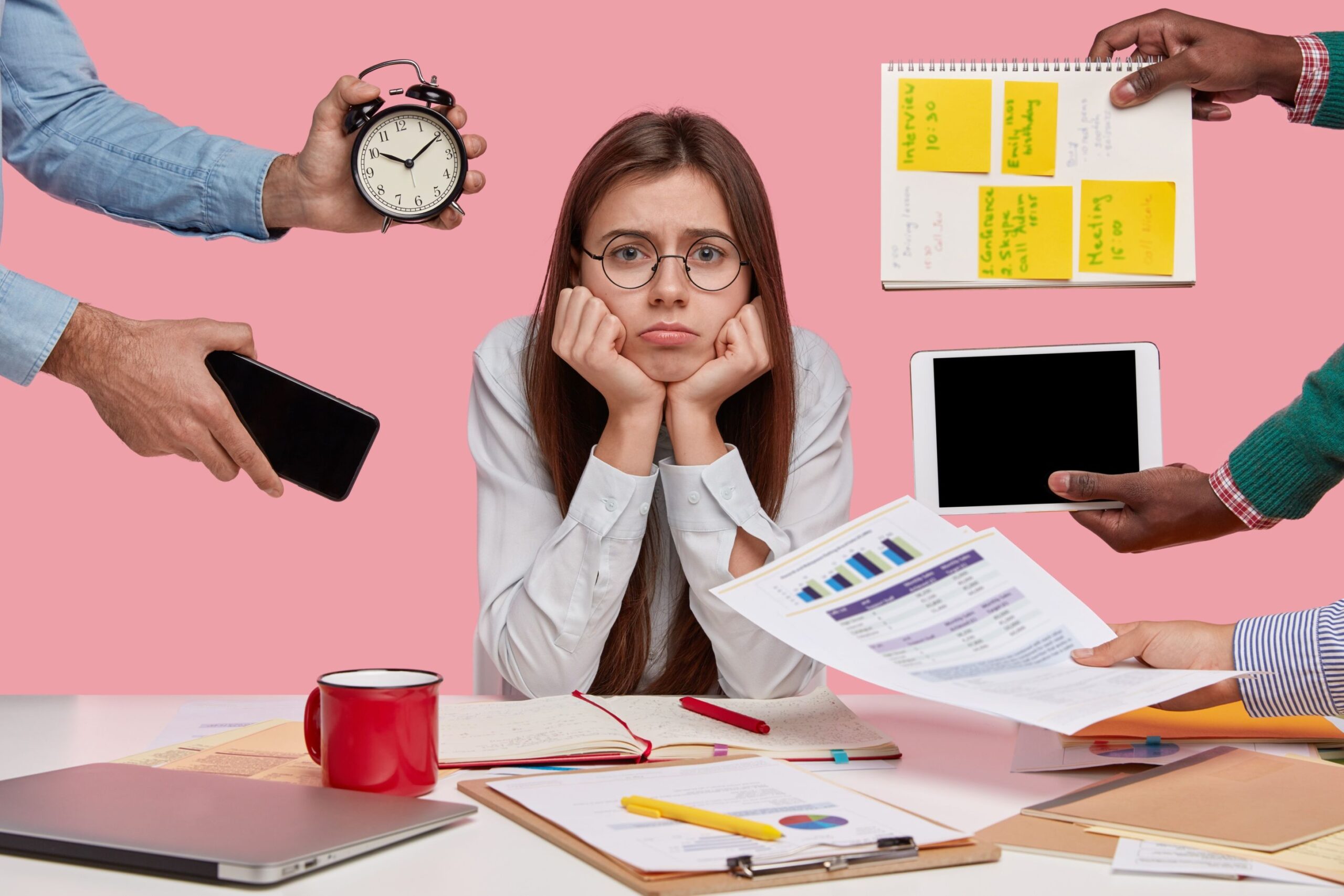 Stressed female professional at workplace dealing with workplace stress management