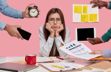 Stressed female professional at workplace dealing with workplace stress management